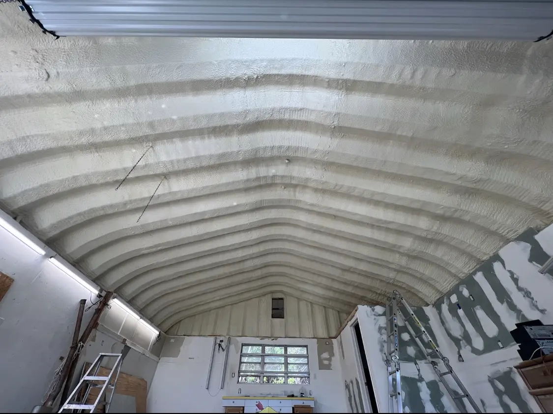 Spray polyurethane foam applied to the underside of a metal roof deck in Litchfield